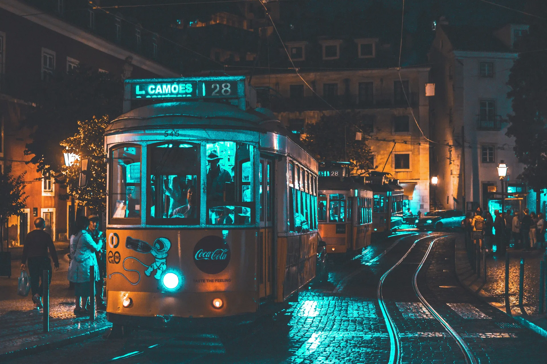 A tram in Lisbon illuminated at night, one of the most charming destinations in Europe to visit in 2025.