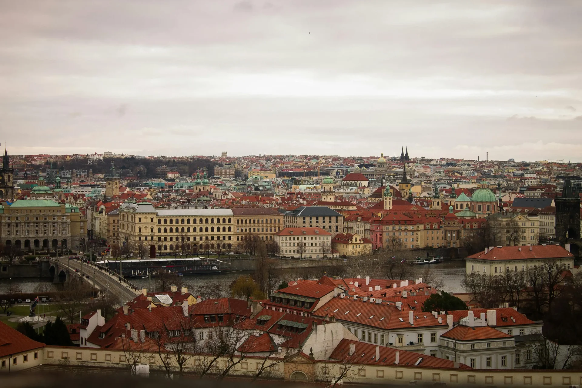 Panoramic view of Prague with its red rooftops and historical monuments, a must-see destination in Europe in 2025.