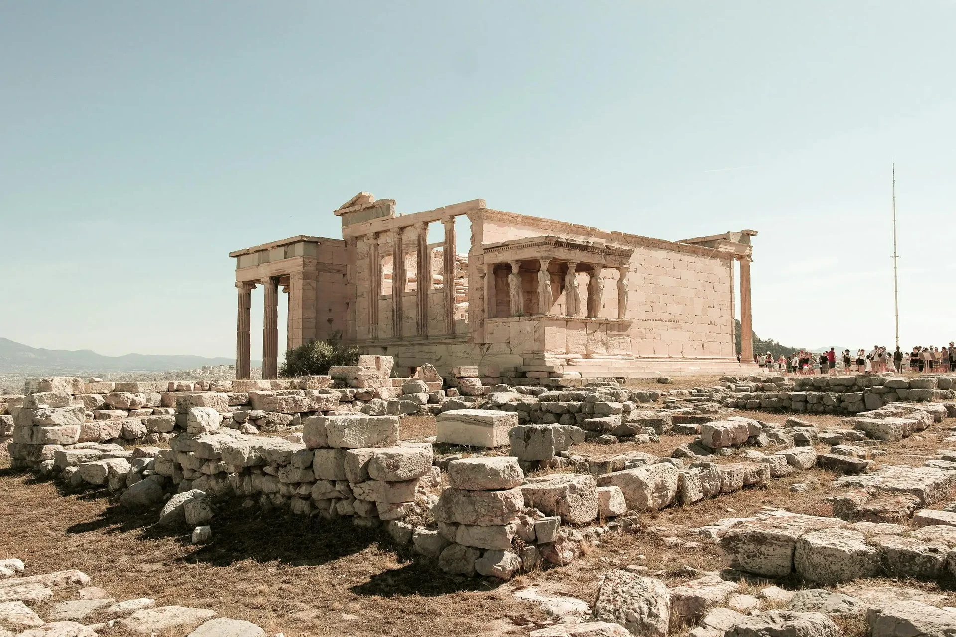 Ruins of the Acropolis in Athens under a blue sky, a destination in Europe with living history to explore in 2025.
