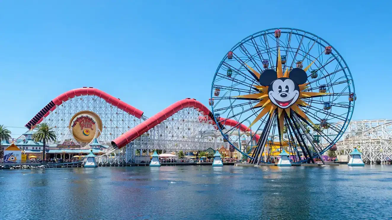 Pixar Pier, Disney California Adventure with a Ferris wheel and a Mickey Mouse image.
